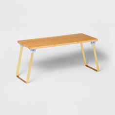 a wooden table with metal legs on a white background