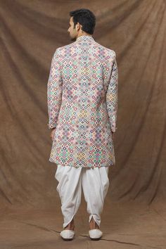 Multi colored straight sherwani in rayon base with abstract patterns and sequin spread. Comes with cowl pant.
Component: 2
Pattern: Embroidered
Type Of Work: Sequins
Neckline: Mandarin Collar
Sleeve Type: Full
Fabric: Sherwani: Rayon, Cowl Pant: Art Silk
Color: Multi Color
Other Details: 
Front button down 
Elasticated waistband with drawstring
Note: Pocket square worn by the model is not for sale
Occasion: Wedding - Aza Fashions Multicolor Long Sleeve Salwar Kameez With Mirror Work, Multicolor Mirror Work Kurta With Traditional Drape, Multicolor Kurta With Mirror Work For Festivals, Designer Multicolor Kurta With Mirror Work, Fitted Multicolor Unstitched Suit For Eid, Multicolor Festival Kurta For Wedding, Multicolor Unstitched Suit With Mirror Work And Traditional Drape, Multicolor Bollywood Kurta For Transitional Season, Multicolor Straight Kurta For All Seasons