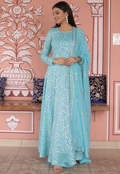 Readymade Faux Georgette Pakistani Suit in Sky Blue. This attire with Poly Shantoon Lining is Enhanced with Tassels, Pocket, Resham and Sequin Work. Crafted in Round Neck and Full Sleeve. Available with a Faux Georgette Palazzo and a Faux Georgette Dupatta in Sky Blue. The Kameez and Bottom Length is 56 and 38 inches respectively.              We sell all kinds of Salwar Kameez sets for Women Georgette Pakistani Suit | Georgette Salwar Kameez | Art Silk Salwar Kameez | Georgette Dupatta | George Blue Sequined Sets For Wedding, Blue Sequined Wedding Set, Blue Sequined Sets For Festive Occasions, Semi-stitched Blue Sequined Anarkali Set, Blue Anarkali Long Sleeve Sets, Blue Embellished Anarkali Set, Blue Floor-length Sequined Anarkali Set, Festive Light Blue Embroidered Dress, Blue Sequined Sets For Festivals