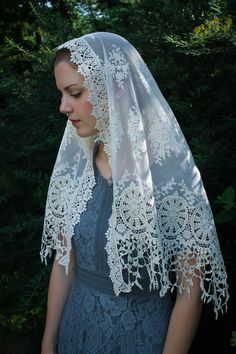 "Evintage Veils~ In an incredibly intricate, beautiful embroidered lace, this soft, ivory veil is of heirloom quality. A medium length mantilla, it provides excellent coverage, and it is soft and comfortable. Measures about 50 X 23 inches. In a long size, here: https://www.etsy.com/listing/1056055539/evintage-veils-mater-dei-heirloom-wrap?ref=shop_home_active_1 Also in an infinity veil here: https://www.etsy.com/listing/960466585/evintage-veilsready-to-ship-mater-dei?ref=shop_home_active_41& Cream Embroidered Lace For Ceremony, Ceremony Embroidered Cream Lace, Vintage Lace With Lace Trim For Ceremony, Cream Lace Veil With Lace Work, Bohemian Cream Crochet Lace, Vintage Embroidered Lace For Wedding, Traditional Crochet Lace For Wedding, Cream Bohemian Lace With Lace Trim, Bohemian Cream Lace With Lace Trim