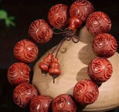 Enhance your spiritual journey with this exquisite Hand-Carved Natural Sandalwood Buddha Beads Bracelet. Each bead is intricately crafted from high-quality, fragrant sandalwood, known for its calming properties and deep connection to meditation and mindfulness practices. This bracelet features 12 finely detailed beads, each carved with traditional Buddhist symbols, adding an extra layer of meaning to your spiritual practice. Whether you wear it during meditation, yoga, or as a daily reminder of Spiritual Carved Beaded Bracelets, Spiritual Carved Beaded Bracelets, Adjustable, Adjustable Carved Beaded Spiritual Bracelets, Adjustable Carved Beaded Bracelets For Spiritual Style, Spiritual Carved Adjustable Bracelets, Spiritual Adjustable Carved Bracelets, Traditional Carved Beaded Bracelets For Gift, Traditional Carved Beaded Bracelets As Gift, Adjustable Carved Bracelets With Round Beads