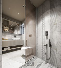 a bathroom with a glass shower door, toilet and sink