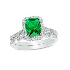 An eye-catching style, this vintage-inspired bridal set matches your bold romance. Crafted in sterling silver, the colorful engagement ring showcases an 8.0 x 6.0mm cushion-cut lab-created verdant-green emerald wrapped in a frame of shimmering petite diamonds - all set atop a glimmering diamond-lined shank. On your wedding day, complete her look with the coordinating band that features a row of alternating marquise-shaped and round frames adorned with sparkling petite diamonds and intricate milg Emerald Cut Diamond Accented Wedding Jewelry, Emerald Cut Diamond Wedding Jewelry With Accents, Silver Princess Cut Emerald Ring For Wedding, Elegant Emerald Ring With Halo Design For Wedding, Classic Halo Design Jewelry For Marriage, Elegant Bridal Sets With Halo Setting For Formal Occasions, Classic Jewelry With Halo Design For Marriage, Elegant Formal Bridal Sets With Halo Setting, Heirloom Emerald Ring With Halo Design For Wedding