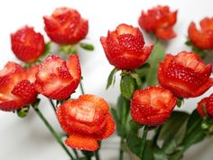 strawberries are arranged in the shape of flowers