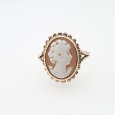 "An vintage cameo ring in solid 9ct 375 yellow gold with a decorative border.  The cameo is hand carved from genuine shell and is in good condition. The inner shank is hallmarked \"V\" for 1995. It weighs approx. 2.8 g. and sizes at approx. UK N or US 6.75. Please check out the other items in my shop. Be sure to view all photos and videos for condition and read the titles and descriptions. Sizes are in the latter photos.  Don't hesitate to send me a message with any queries. All my items are use Victorian Gold Cameo Rings, Gold Cameo Signet Ring Collectible, Gold Signet Ring With Cameo Collectible, Gold Round Cameo Signet Ring, Vintage Gold Cameo Ring, Gold Cameo Rings For Anniversary, Classic Gold Cameo Signet Ring, Gold Cameo Signet Ring 14k, Classic Gold Signet Ring With Cameo