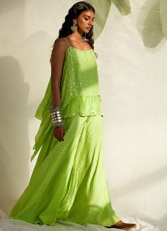 Channel your inner boho queen in this Lime Green Spaghetti double-layered short Bandhej kurta with mirror detailing teamed with matching Bandhej Sharara pants. Dupatta can be added at an additional cost Composition : Silk Care: Dry Clean Only and Vacuum Storage This product can be customised for sleeves, length of blouse and neckline Delivery : 4-6 weeks as the product is hand crafted. For more information and sizes please contact fabiliciousfashion@gmail.com or visit our Copenhagen studio.About Bandhani Sharara, Green Spaghetti, Boho Queen, Sharara Pants, Layered Short, Pink City, Vacuum Storage, Indian Wedding Wear, Sharara Set