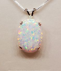 "Large White Lab Created Opal 15x20mm Full Of Rainbow Fire-See Video! There Is More Pink Than Photos Show. Sleek 925 Sterling Silver Pendant With Choice Of Setting Styles, Split Bail, OR Single Dangle (Choose In Drowndown)18\" Sterling Chain. Chain Length Options Available By Messaging Seller At Time Of Purchase. Message Seller For Availability. Great Gift! Gift Box Included * I Have An Even Larger One Too! https://www.etsy.com/Cloudrivercreations/listing/1303871722/huge-white-opal-necklace-18x25mm" Classic Multicolor Jewelry For Gifting, Classic Multicolor Jewelry For Gift, Classic Multicolor Jewelry Gift, Opal Jewelry Necklace, Rainbow Fire, Hand Necklace, White Lab, Pinterest Ideas, Necklace Making