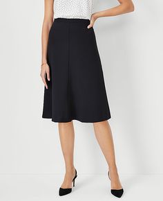 Elevate your wardrobe with the Ann Taylor Petite Flare Skirt in Fluid Crepe, a piece that perfectly marries sophistication with a playful swing. This skirt is a must-have for those who appreciate a tailored fit combined with effortless style.

- Size: Petite 0
- Color: Black
- Material: 95% Polyester, 5% Spandex
- Length: 25 inches, hits at knee
- Closure: Hidden back zipper with hook-and-eye
- Care: Machine washable

Designed for the modern woman, this skirt is lined for comfort and crafted wit Below Knee Skirt Outfits, A Line Work Skirt, Skirts For Women Over 60 Years Old, Black Womens Suit, Work Skirt Outfit, A Line Skirt Outfits, Black Knee Length Skirt, Suit Skirts, Ponte Skirt