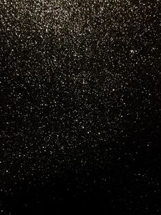 the sky is filled with lots of tiny white dots on it's black surface