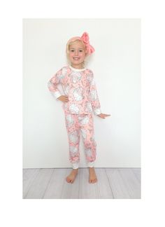 "Girls Retro Santa Print Christmas Pajama *Bring in the season with this adorable boutique PJ set! *Butter cotton (cotton blend) is soft and washes well. *Manufactured by a production partner of Hissy Fitz Boutique 12/18 mo top: 14\" long & 9.5\" wide pants: 19\" long & 8.5 wide hips 2t top: 15\" long & 10.5\" wide pants: 20\" long & 9 wide hips 3t top: 16\" long & 11.5\" wide pants: 21\" long & 9.5 wide hips 4t top: 17\" long & 12.5\" wide pants: 22\" long & 10\" wide hips 5/6 top:18\" long & 1 Playful Cotton Sleepwear For Holidays, Playful Cotton Holiday Sleepwear, Playful Holiday Cotton Sleepwear, Cute Cotton Holiday Sleepwear, Cute Pink Sleepwear For Holiday, Cute Bedtime Sets For Christmas, Cute Bedtime Christmas Sets, Cute Christmas Bedtime Sets, Pink Cotton Christmas Sleepwear