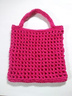 This bright, colorful macrame-style carryall will be your favorite go-to bag for summer!  This bag is hand crocheted and eco-friendly. Made from rope for durability.  Its open weave design stretches to hold all your beach or swim essentials but easily returns to its original size and shape. Measures 14 inches tall and 16 inches wide with 8 inch drop handles. Folds flat and rolls up easily for packing or storing. Can be used as a market bag. Makes a great gift too 😍 Pink Crochet Rectangular Beach Bag, Rectangular Pink Crochet Beach Bag, Pink Summer Crochet Bag, Pink Crochet Beach Bag For Everyday Use, Pink Crochet Bag For Beach, Pink Crochet Bag For The Beach, Pink Crochet Bag For Summer Shopping, Summer Pink Crochet Bag, Casual Pink Crochet Beach Bag