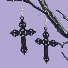 A pair of statement dangle earrings, large black gothic cross charms on 925 sterling silver ear wires.  MEASUREMENTS The cross charm measures 5.7cm x 3.7 cm MATERIALS These earrings are made with 925 sterling silver ear wires, which are hypoallergenic SHIPPING These earrings are made to order and will be sent with 1st class postage. -------------------- A matching velvet choker is also available:  https://www.etsy.com/uk/listing/1115524210/gothic-cross-velvet-choker-various?click_key=dc02222e5f89f5845d6c1f5408a2b634dc2dc9c5%3A1115524210&click_sum=25c7c0d8&ref=shop_home_feat_2 -------------------- Feel free to message me if you have any further questions! Don't forget to follow my Instagram @badghoulsclubuk to stay updated on new products and sales 🖤 Thanks for visiting! Goth Jewellery, Fashion Goth, Cross Choker, Gothic Cross, Gothic Crosses, Goth Jewelry, Metal Cross, Velvet Choker, Dark Gothic