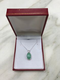 Featured here is a stunning, cabochon oval Colombian emerald necklace in fine .925 sterling silver. Displayed is a light-green emerald bezel set in an elongated silver setting. The earth mined, green Colombian emerald has a light green color with good clarity. An 18 inch chain is included with the emerald pendant. This is an excellent gift for a May baby or for someone who simply loves emeralds. Total Carat Weight: 5.0cts Setting Style: Bezel Setting Material: .925 Sterling Silver Main Stone: Co May Baby, Light Green Color, Jupiter Fl, Colombian Emeralds, Emerald Pendant, Emerald Necklace, Emerald Engagement, Silver Engagement Rings, Solitaire Pendant