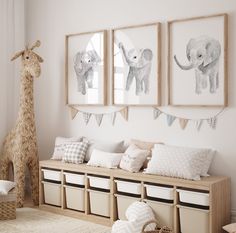 a baby's room decorated in white and blue with animals on the wall above