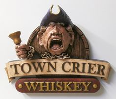 a sign that says town crier whiskey with an evil looking man holding a hammer