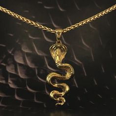 This is a Cobra necklace, a handmade jewelry. This unisex necklace is the perfect gift for him and her any time of the year  Immerse yourself in the mystical world and discover your inner power with our handmade cobra pendant necklace. Inspired by the sacred serpent, this handmade pendant invites you to explore spirituality and awaken your inner strength. The cobra symbolizes transformation, rebirth, and ancient wisdom. Its presence evokes the energy of kundalini, a powerful life force that lies Spiritual Gold Plated Necklace As A Gift, Symbolic Snake-shaped Brass Jewelry, Spiritual Tarnish-resistant Necklace As Gift, Spiritual Brass Jewelry In Snake Shape, Spiritual Brass Snake-shaped Jewelry, Spiritual Snake-shaped Engraved Jewelry, Spiritual Engraved Snake Jewelry, Snake-shaped Engraved Jewelry Gift, Symbolic Snake-shaped Necklace For Gift