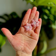 Charming Pink Daisy Micro Crochet Dangle Earrings--A delicate floral touch to elevate your style. Handcrafted with precision using quality cotton thread, these earrings are not only lightweight but also hypoallergenic, ensuring comfort for sensitive ears. The intricate micro crochet technique showcases a soft, delicate pink design, adding a touch of nature-inspired elegance to any outfit. Treat yourself or a loved one to these unique, artisanal earrings that effortlessly blend beauty and craftmanship.   These flowers are approximately 2.5cm in size. They have been crocheted by me with a 1.5mm hook and cotton thread, then finished with hypoallergenic silver-plated copper sterling ear wires. Pink Crochet Jewelry Gift, Handmade Dainty Flower Earrings, Delicate Handmade Dangle Earrings, Elegant Crochet Jewelry With Flower Shape, Handmade Everyday Flower Drop Earrings, Handmade Dainty Flower Drop Earrings, Adjustable Pink Crochet Jewelry, Dainty Handmade Drop Flower Earrings, Handmade Flower Earrings For Crafting