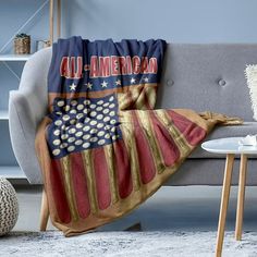 an american flag throw blanket on a couch