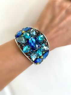 Blue Crystal Cuff Bracelet Multi Stone Blue Stone Statement Bangle Bracelet Luxury Blue Cuff Bracelet With Oyster Design, Luxury Multi-stone Cuff Bracelet, Adjustable Jeweled Cuff Bracelet For Party, Trendy Turquoise Bracelets For Party, Trendy Light Blue Jewelry For Party, Trendy Light Blue Party Jewelry, Blue Beaded Crystal Bangle Bracelet, Blue Beaded Bangle Cuff Bracelet, Blue Beaded Cuff Bangle Bracelet