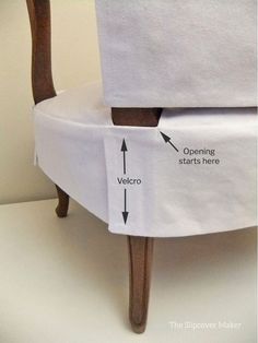 an upholstered chair is labeled with instructions