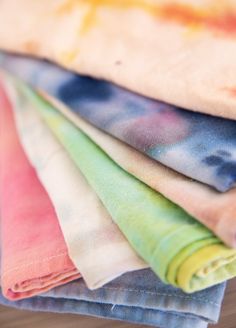 several different colored napkins stacked on top of each other