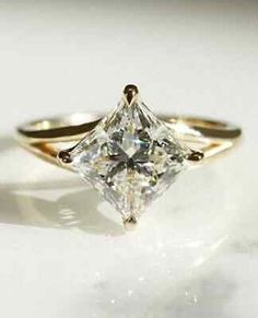 an engagement ring with a princess cut diamond