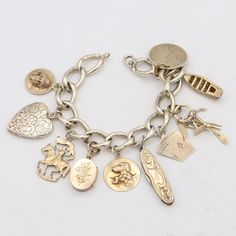 Weight: 56.8 Grams Charms: 17.5 - 23 x 26 mm Bracelet Size:  6.5 Inches Hallmark: F&B, Sterling Item #:  BR-1051-091823-18 Vintage Charm Bracelet, Bracelet Sizes, Charm Bracelets, Vintage Charms, Arm Band, Hallmark, Jewelry Bracelets, Gold Tones, Charms