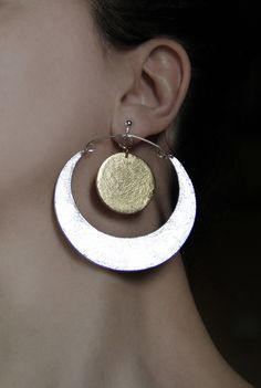 Sun and moon clip on earrings. Lovely inspirational jewelry in silver and gold. Metallic color dangle and drop earrings. Big, statement jewelry - a nice gift for her. Handcrafted with LOVE! Size: 2.9 inch x 2.7 inch 7.4 cm x 6.8 cm They can be made in the following color combinations: 1) Gold sun + Silver moon (crescent) as pictured 2) Gold moon (crescent) + Silver sun 3) Gold moon (crescent) + Copper sun 4) Copper sun + Silver moon (crescent) 5) Copper moon (crescent) + Silver sun 6) Copper moo Gold Clip-on Sterling Silver Jewelry, Gold Jewelry With Moon Charm For Party, Gold Clip-on Hoop Earrings In Sterling Silver, Gold Sterling Silver Clip-on Hoop Earrings, Modern Clip-on Jewelry For Gifts, Modern Clip-on Jewelry As Gift, Handmade Clip-on Dangle Earrings For Anniversary, Silver Brass Hoop Earrings, Silver Clip-on Earrings In Brass