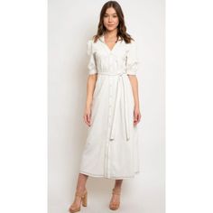 Ivory Short Sleeve Button Down Long Dress W/ Black Contrast Stitching. Detachable Tie Belt. 95% Cotton 5% Spandex Elegant Cream Dress With Button Closure, Elegant Dresses With Button Cuffs For Brunch, Collared Maxi Dress With Buttons For Day Out, Elegant Buttoned Maxi Dress For Brunch, White Workwear Dresses With Covered Buttons, Elegant Maxi Dress With Buttons For Brunch, Elegant Maxi Dress With Button Closure For Day Out, Chic Cream Buttoned Dress, Elegant Button-up Maxi Dress With Button Closure