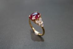 Product Specifications: - 2.00 High quality natural Pigeon Blood Oval Cut Ruby at the center - 6 Round Brilliant cut Diamonds, total carat around 0.18ct - 4 Marquise cut Diamonds, total carat around 0.24ct - D-F in color and VS in clarity with Heart and Arrow (Ideal cut) - 18K Yellow Gold - Ring Width: 2.3mm Currently made to order pieces may take up to 10-15 business days to complete, or let me know if you need it urgent. It's easy to create jewelry that's perfect for you. Change the materials Brilliant Cut Diamond Engagement Ring, Blood Ruby, Yellow Gold Diamond Engagement Ring, Marquise Diamond Engagement Ring, Natural Ruby Ring, Marquise Diamond Ring, Marquise Shape Diamond, Diamond Cluster Engagement Ring, Yellow Engagement Rings