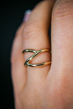 This beautiful 14kt gold-fill wrapped ring will become a staple in your wardrobe. This ring is handcrafted out of a D-shaped (half round) metal. Two ends connect at the center of the ring create a branch-like design. This ring is whimsical, classic and infinitely stylish. Please note, this listing if for ONE single ring in 14K Gold-fill. + Available In Silver (sold separately): https://www.etsy.com/listing/240271360/silver-branch-ring-sterling-silver + View More Stacking Rings: https://www.etsy. Gold Wrap Ring, Gold Stacking Ring, Criss Cross Ring, Woven Ring, Minimal Ring, Branch Ring, Single Ring, Bold Rings, Gold Wrap