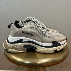 Balenciaga’s Triple S Sneaker Gets Its Name From Its Stacked Sole Unit, Which Takes Elements From Three Sports Shoes - Running, Basketball And Track - To Create The Chunky, High-Tech Silhouette That’s Stomped Down Streets And Runways Since 2017. This Pair Is Constructed With Panels Of Mesh, Lambskin And Calfskin In Creamy Vanilla And Sand Tones, Then Tied Off With The Style’s Signature Hiking-Style Laces. Contrasting Black Embroidery Signs It Off At The Sidewall. These Sneakers Are Gently Used And In Great Condition. Hiking Style, Hiking Fashion, Black Embroidery, Shoes Running, Balenciaga Triple S, S Signature, Sports Shoes, Mens Shoes Sneakers, High Tech