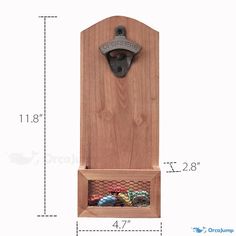 a wooden wall mounted bottle opener with mesh storage