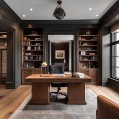 a home office with built in bookshelves and desk