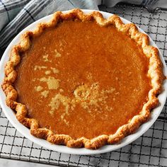 a pie sitting on top of a white plate