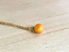 This dainty orange / tangerine necklace is made of the following: (1) Gold plated orange slice charm (charm size: 12 x 8.5mm) (2) Gold plated or 14KGF chain and findings ✏️ Please choose the length of the chain (the length includes clasp and findings) ✏️ Please choose your desired plating of chain ❣️ If you are unsure about which length to choose , please leave me a note to request an extension chain to be added to the chain at check out. 🍊EARRINGS 🍊 Threader -> https://www.etsy.com/listing Nickel-free Orange Necklace As Gift, Nickel-free Orange Necklace For Gift, Adjustable Peach Jewelry For Gifts, Orange Pendant Charm Necklaces For Gifts, Orange Necklace With Adjustable Chain For Gift, Orange Necklace With Adjustable Chain As Gift, Orange Round Necklace For Gifts, Adjustable Orange Nickel-free Necklace, Delicate Peach Jewelry For Gifts