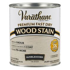 a can of wood stain on a white background