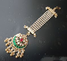 Elegance of timeless Real Pachi Kundan combined with high grade Beads. This delicate mangtikka is set in copper alloy and plated with 22k gold.It will go with everything and make your outfit super chic. 100% top Quality  -22K gold and silver Plated silver copper alloy. Multicolor * Our all jewelry is made from semiprecious stones and beads. Care Tip - 1. Keep away from moisture and perfume 2. Store in cotton or zip lock bags or air tight boxes. 3. Spot cleaning only. About us: kundanjewelsbyshiv Punjabi Jewelry, Chain Headpiece, Hair Chains, Semi Precious Jewelry, Precious Jewelry, Jewelry Business, 22k Gold, Gold And Silver, Hair Jewelry