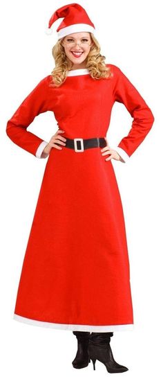 a woman in a red dress and santa hat standing with her hands on her hips