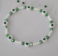 St. Patrick's Day beaded bracelet with Charms and Letter Beads, St. Patrick's Day, Stretch Bracelet This bracelet is made with custom sizing.  You choose from 6 to 8 inches. if you need a smaller or larger size please message me the details. Listing includes ONE bracelet. Any images shown with multiple bracelets is to be used as an example of how they can be stacked with other Bracelets. ALL ORDERS ARE FINAL SALE. THESE ARE CUSTOM BRACELETS MADE TO ORDER. PLEASE DOUBLE CHECK SIZE SELECTIONS PRIOR TO CHECKOUT.  CARING TIPS:  - Do not expose jewelry to water - Treat and store jewelry gently - Roll bracelets on rather than stretching band to get on. The beads used for this bracelet are small (8/0 Glass Seed Beads) and should not be used for children under 4 years old.  Please don't let the ch Beaded Bracelet With Letters, Concert Bead Bracelets, Double Beaded Bracelet Diy, Basic Beaded Bracelet, Cute Small Bead Bracelet Ideas, Bracelet Small Beads, Small Beads Ideas, St Patricks Day Bracelet, Handmade Green Heart Beaded Bracelets