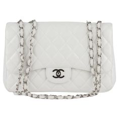 Chanel jumbo single Flap Bag features white diamond quilted leather. A leather-threaded polished silver chain-link shoulder strap, a rear patch pocket, and a matching silver classic CC turn-lock. This opens the bag to reveal an inner zipper pocket. Collection 12, copy of original receipt. Shoulder drop 13". Excellent exterior, minor wear in the interior. Hologram and dust cover. Classic White Double Flap Bag, White Double Flap Formal Bags, Elegant White Double Flap Shoulder Bag, Classic White Bag With Cc Turnlock Closure, Elegant White Quilted Bag, Chic White Double Flap Shoulder Bag, White Quilted Bag For Formal Occasions, White Leather Shoulder Bag With Cc Turnlock Closure, White Leather Double Flap Shoulder Bag