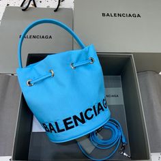 Balen Le Cagole Medium Bucket Bag In Light Blue Balenciaga Bag, Bago, Shoulder Pads, Monaco, Bucket Bag, Designing Women, Contact Us, Balenciaga, Clutch Bag