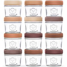 six glass storage containers with lids and lids in different colors, each containing a brown lid