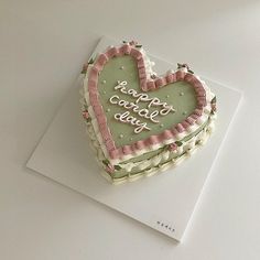 a heart shaped cake sitting on top of a piece of paper