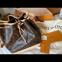 Louis Vuitton Petit Noe Bucket Bag Brand New Bucket Bag, Never Been Worn Comes With Dust Bag, Original Box, Blue Ribbon 9.8 X 10.6 X 7.9 Inches , Length X Height X Width -Monogram Coated Canvas -Natural Cowhide-Leather Trim -Textile Lining -Gold-Color Hardware -Drawstring Closure -Strap Drop/ 10.2 Inches -Strap Drop Max: 12.6 Inches Designer Bucket Bag With Removable Pouch In Monogram Canvas, Designer Monogram Canvas Bucket Bag With Removable Pouch, Luxury Bucket Shoulder Bag In Signature Coated Canvas, Designer Monogram Canvas Bucket Bag For Daily Use, Designer Daily Use Bucket Bag In Monogram Canvas, Designer Monogram Canvas Bucket Satchel Bag, Signature Coated Canvas Bucket Travel Bag, Designer Bucket Bag For Travel, Designer Travel Bucket Bag