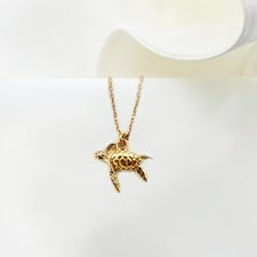 "TINY TURTLE necklace, gold plated Silver 925 realistic Turtle charm, tortoise Animal jewelry, Turtle Lover gift, swimming sea turtle jewelry ♡ DESCRIPTION  A dainty tiny  necklace with beautiful filigree  tortoise charm. ♡ DETAILS   turtle high: 1.4 x 1.6 cm- 0.55\" x 0.62\" Total chain length : 16.5\"(42 cm) Material: gold plated 24 k over sterling silver 925  extender chain you can find here: https://www.etsy.com/listing/723669241/add-an-extender-chain-with-tiny-heart?ref=shop_home_active_2 ♡