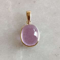 DESCRIPTION: This stunning Pendant is set in 14k Solid Yellow Gold with Natural Kunzite with utmost precision. It is a unique gemstone Pendant for nearly every occasion and is completely hassle-free jewelry. ITEM DETAILS: * GEM : Kunzite * GEM SIZE: 9X11mm * GEM SHAPE: Oval * Gem weight: 7.30 carats * Gold Purity: 14KT (58.33% approx.) * Gold Weight: 0.54gram * Total Weight of the Pendant: 2.00 gram The Gold purity is guaranteed and it comes with authentic 14KT gold hallmark. Since my items are handmade, they are absolutely nickel and lead free. CUSTOMIZATION: * Gemstone customization is available and it can be substituted with a gem of your choice. Kindly message me for the same. PACKAGING * The Pendant comes with layers of safe and secure wrapping along with Free handmade jewelry box wit Oval Gemstones For Formal Occasions, Elegant Cabochon Amethyst Gemstones, Elegant Amethyst Cabochon Gemstones, Formal Oval Gemstones, Gold Cabochon Gemstones For Formal Occasions, Formal Gold Cabochon Gemstones, Luxury Gold Oval Cabochon Gemstones, Yellow Gold Polished Oval Cabochon Gemstones, Polished Yellow Gold Oval Cabochon Gemstones