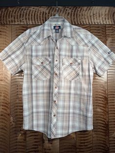 Dickies Brand Western Wear Snap Button Western Shirt. Plaid western short sleeve. Perfect for any occasion. Nice snap button shirt. Great looking snap buttons. Condition: Great Materials: Cotton, Polyester  Brand: Authentic Dickies Since 1922 Size: Medium (M) Please message for any questions about the item or measurements. Brown Button-up Camp Shirt, Western Style Brown Tops With Buttons, Western Brown Tops With Buttons, Brown Western Style Top With Buttons, Brown Western Top With Buttons, Classic Brown Button-up Short Sleeve Shirt, Short Sleeve Brown Shirt With Buttons, Country Style Short Sleeve Tops For Western-themed Events, Country Style Shirt For Summer Rodeo