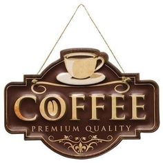 a coffee sign hanging from the side of a wall