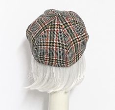 Red, forest green & white plaid vintage wool beret hat, lined in rayon print, the top of the hat is made up of 6 section crown, wool bias 1" fitted band and !' soft elastic band inside. One size fits most up to a 22" head size Made in the USA Dry Clean Classic Plaid Hat With Short Brim, Classic Plaid Hat For Fall, Adjustable Plaid Flat Cap, Classic Plaid Fall Hat, Plaid Cap One Size Fits Most, Wool Berets, Beret Hat, White Plaid, Elastic Band